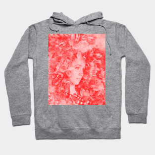 Beautiful girl, near the flowers. Red, beautiful. Hoodie